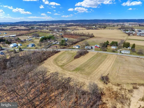a view of a swimming pool with an outdoor seating