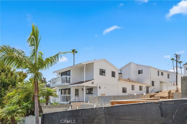 a front view of a building with garden