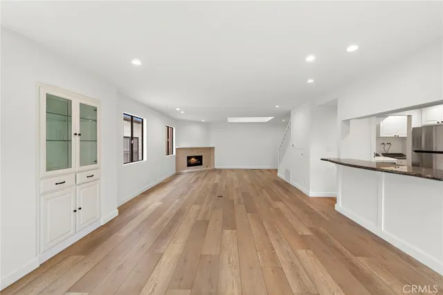 a view of a kitchen with wooden floor