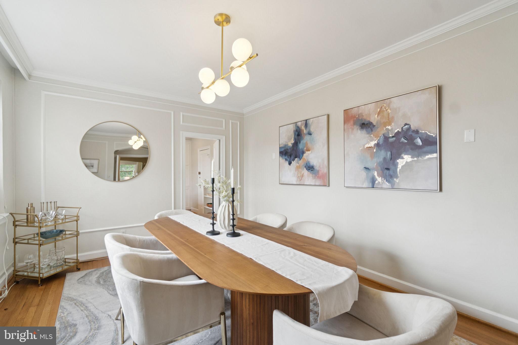 2737 Devonshire Place Northwest, Unit 503 Washington, DC 20008 - Photo 14 of 49 a view of a dining room with furniture and a chandelier fan