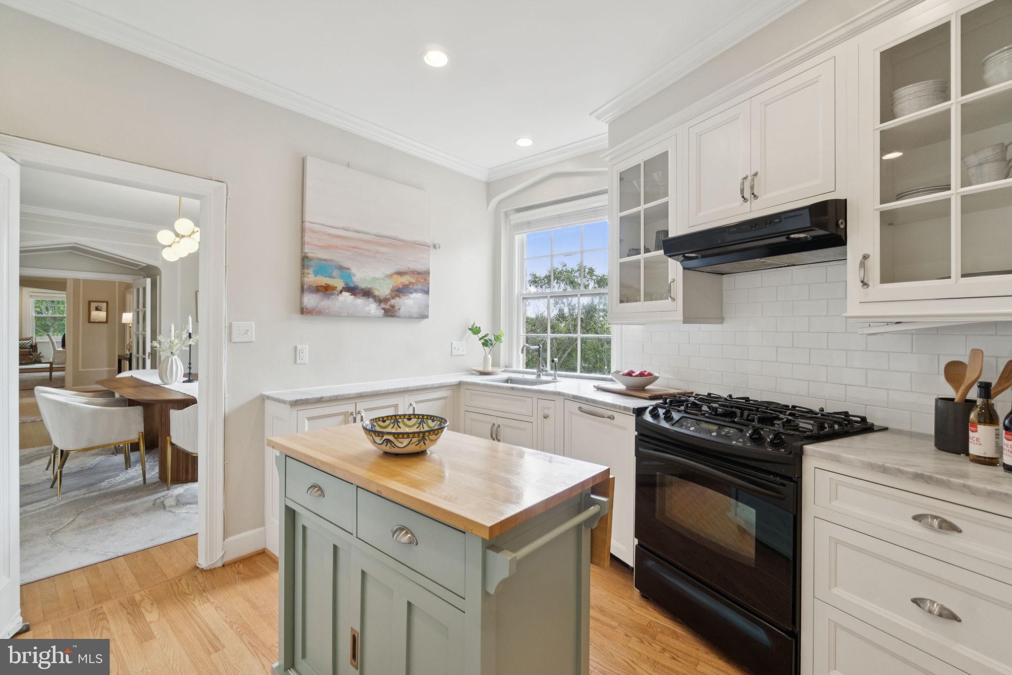 2737 Devonshire Place Northwest, Unit 503 Washington, DC 20008 - Photo 15 of 49 a kitchen with a stove a sink and cabinets