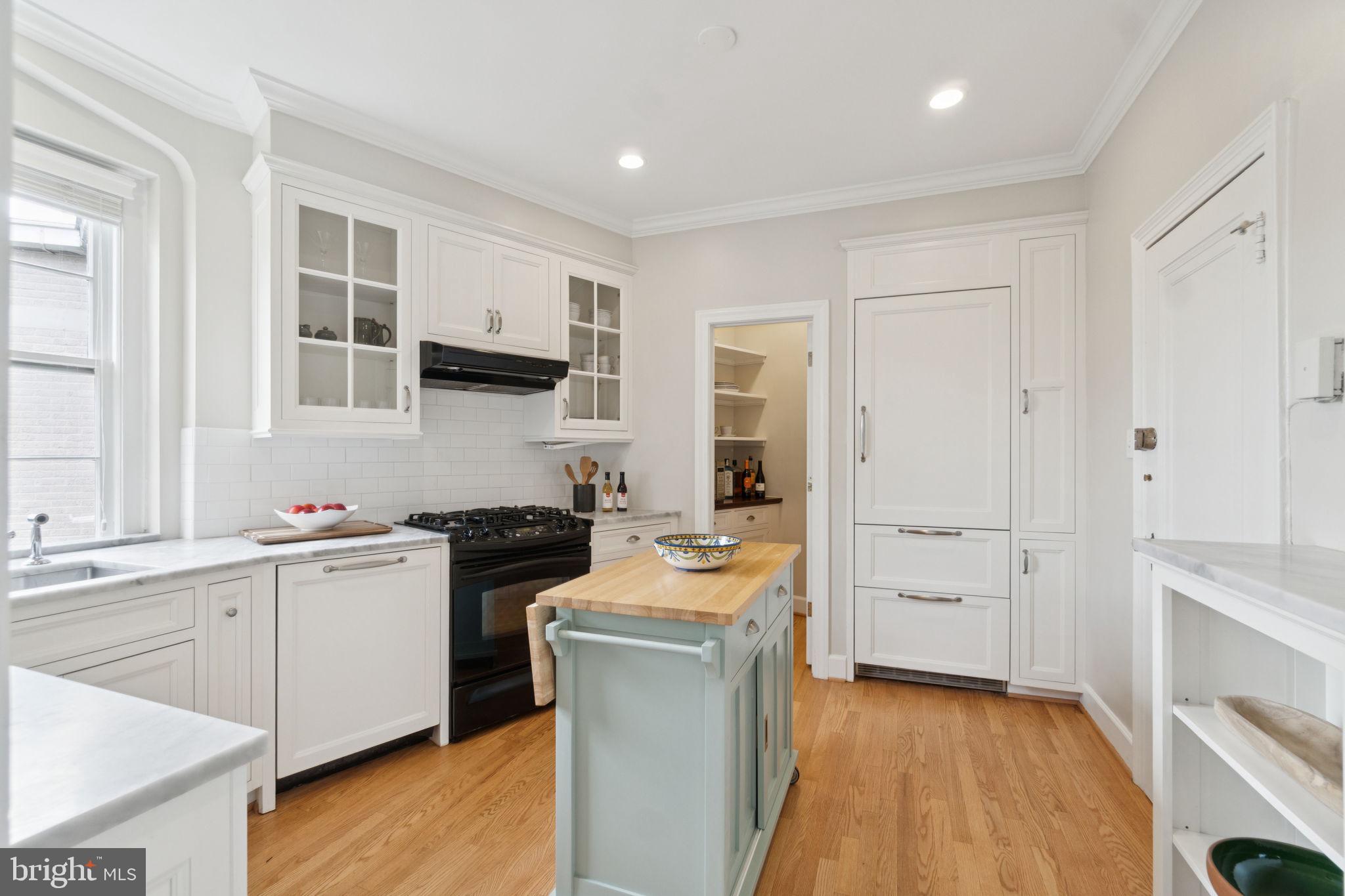 2737 Devonshire Place Northwest, Unit 503 Washington, DC 20008 - Photo 17 of 49 a kitchen with a refrigerator stove and sink