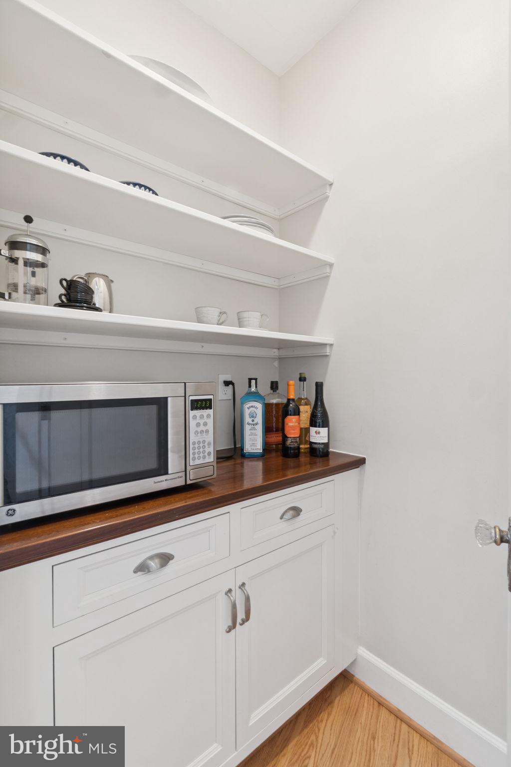 2737 Devonshire Place Northwest, Unit 503 Washington, DC 20008 - Photo 18 of 49 a view of white cabinets and wooden floor