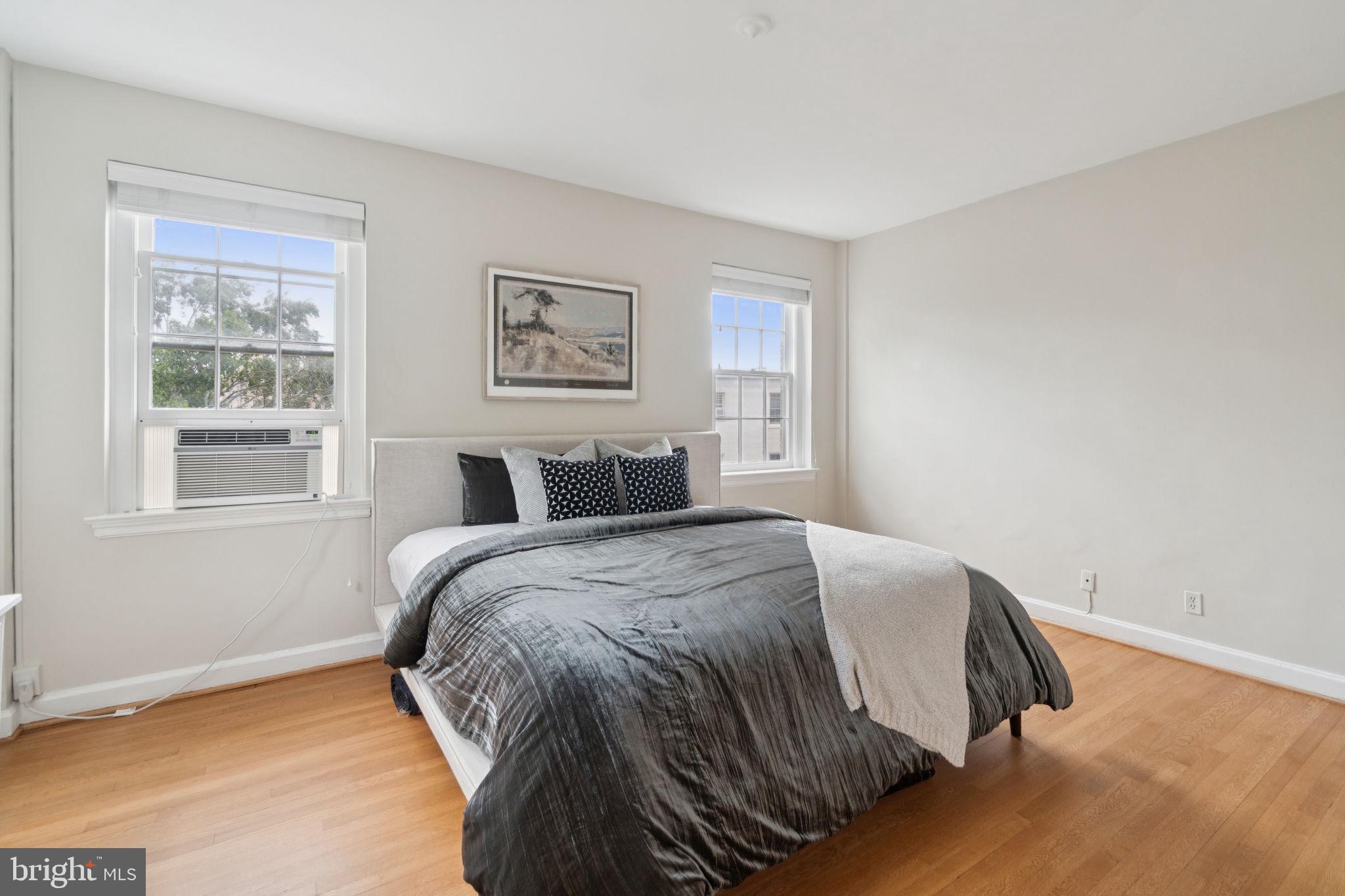 2737 Devonshire Place Northwest, Unit 503 Washington, DC 20008 - Photo 20 of 49 a bed sitting in a bedroom next to a window