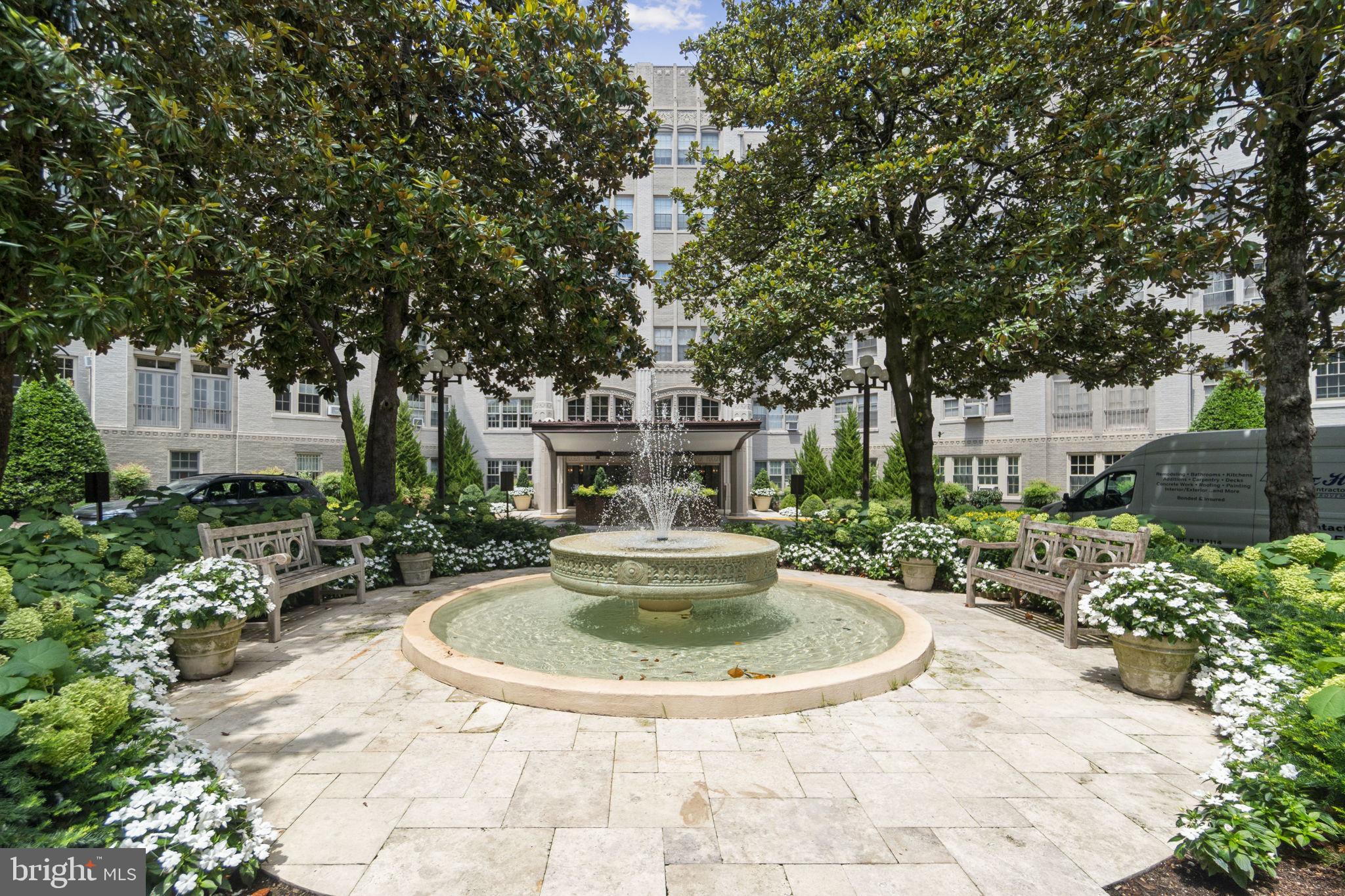2737 Devonshire Place Northwest, Unit 503 Washington, DC 20008 - Photo 2 of 49 a view of a fountain in the backyard of house