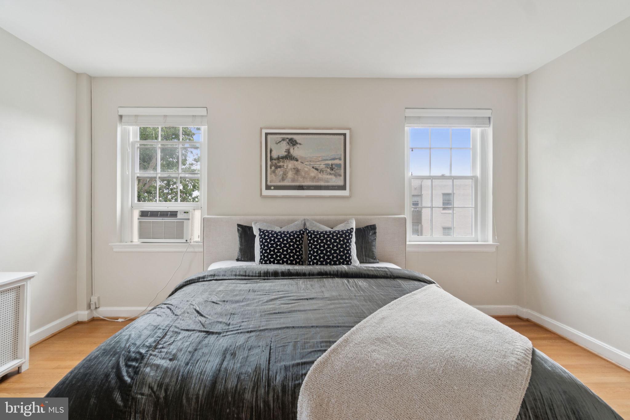 2737 Devonshire Place Northwest, Unit 503 Washington, DC 20008 - Photo 21 of 49 a bedroom with a large bed and a window