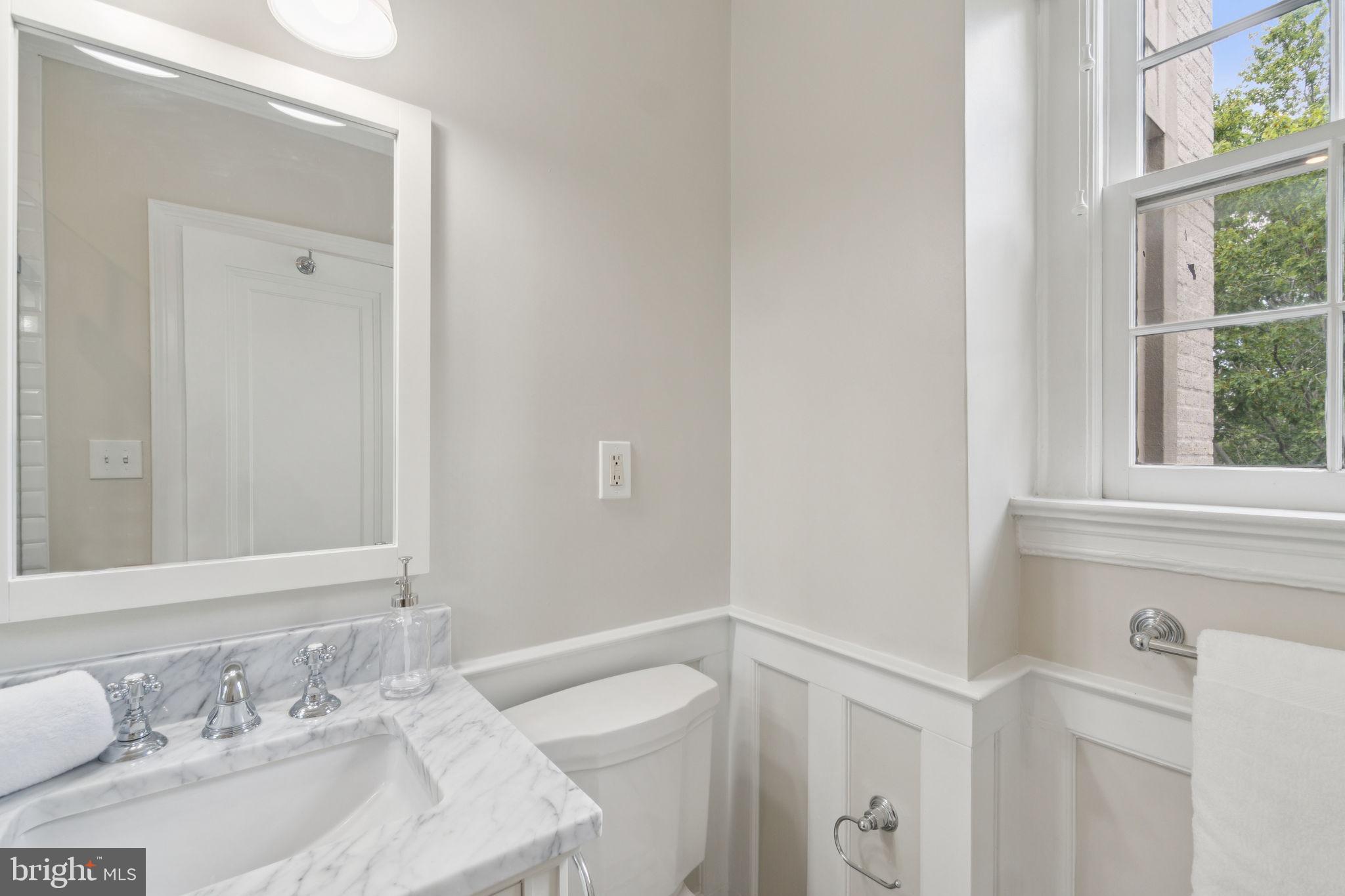 2737 Devonshire Place Northwest, Unit 503 Washington, DC 20008 - Photo 22 of 49 a bathroom with a sink and a mirror