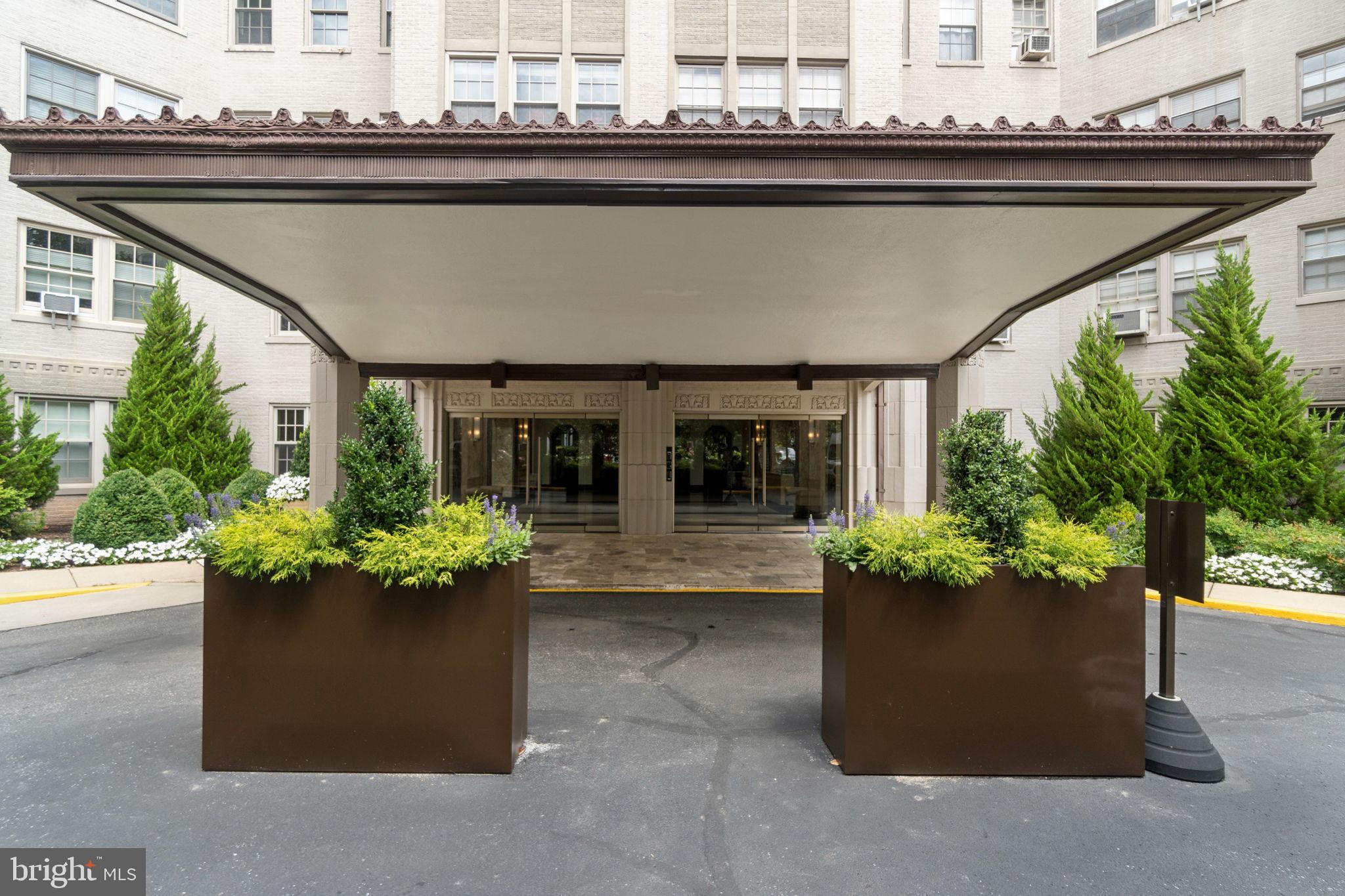 2737 Devonshire Place Northwest, Unit 503 Washington, DC 20008 - Photo 48 of 49 a living room with a lot of flower and furniture