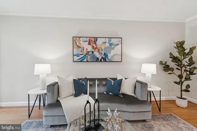 a view of a livingroom with furniture and a lamp
