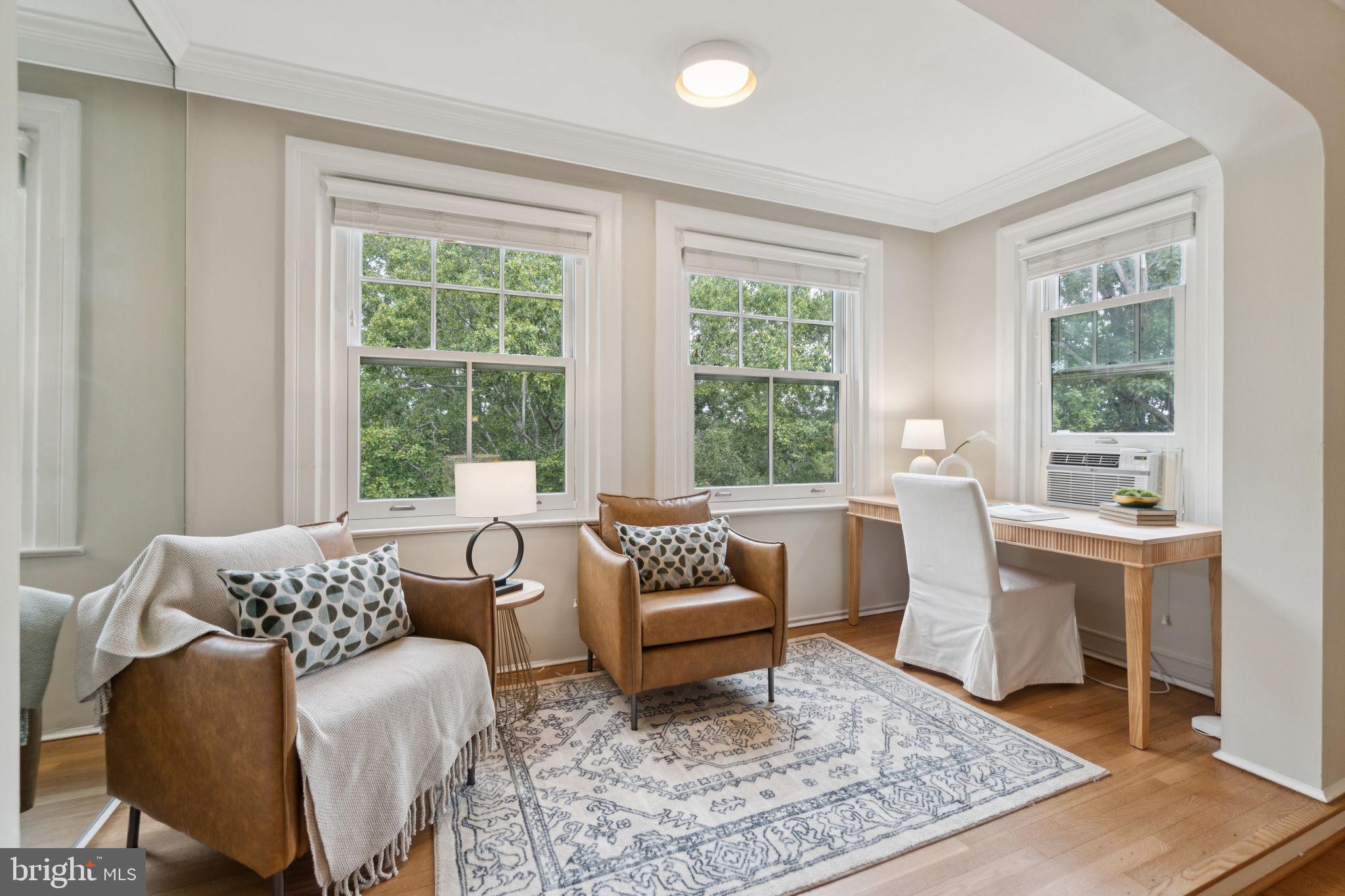 2737 Devonshire Place Northwest, Unit 503 Washington, DC 20008 - Photo 8 of 49 a living room with furniture and a rug