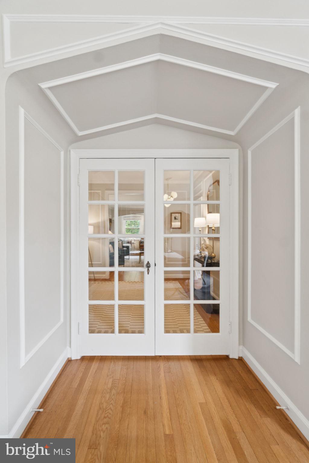 2737 Devonshire Place Northwest, Unit 503 Washington, DC 20008 - Photo 10 of 49 a view of an empty room with a window and wooden floor