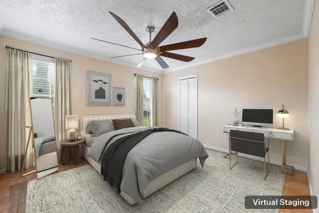 a bedroom with a bed and a desk