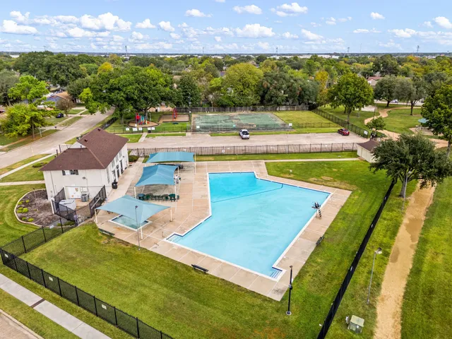 an aerial view of residential houses with outdoor space