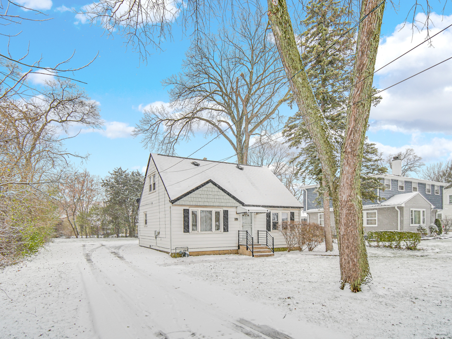 3009 Olive Road Homewood, IL 60430 - Photo 17 of 22 a view of a white house with a large tree and wooden fence