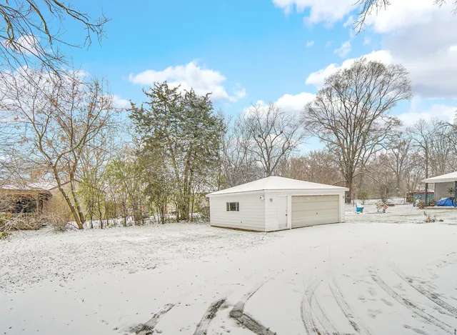 a view of house with a snow in the background