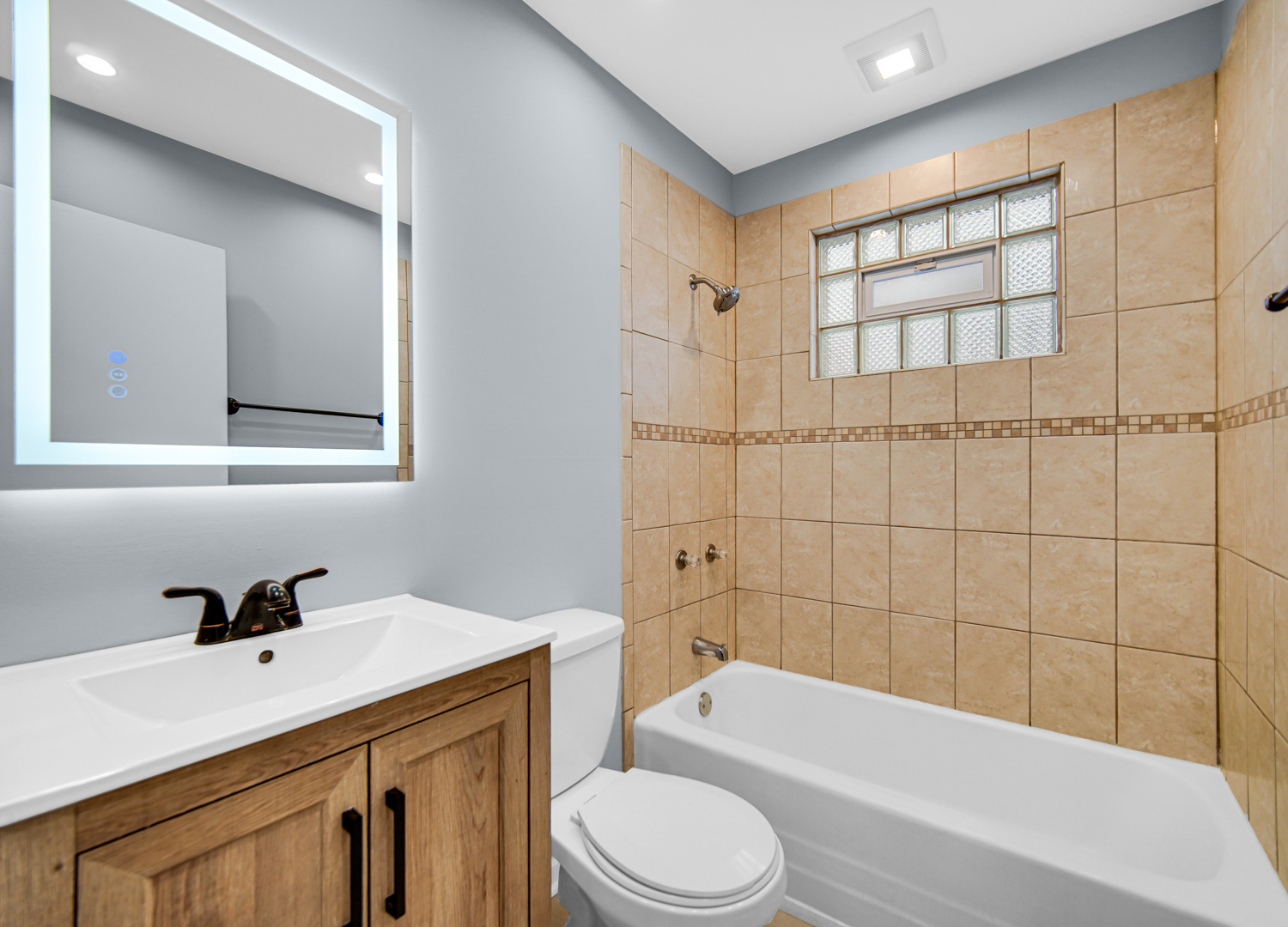 3009 Olive Road Homewood, IL 60430 - Photo 2 of 22 a bathroom with a sink a toilet and shower