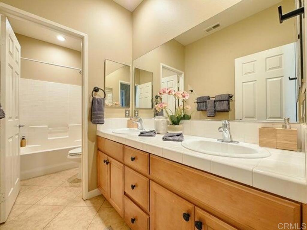 80596 Key Largo Avenue Indio, CA 92201 - Photo 19 of 59 a bathroom with a tub sink and mirror