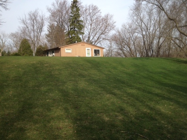 103 North Haman Road Inverness, IL 60010 - Photo 8 of 12 a front view of a house with a yard
