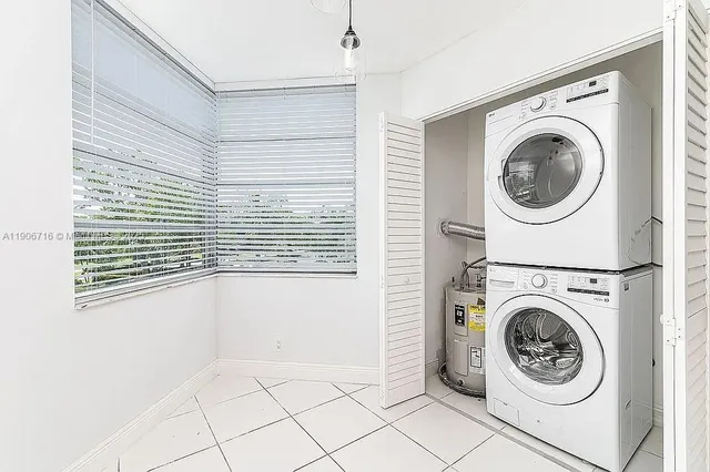 a view of a hallway with washer and dryer