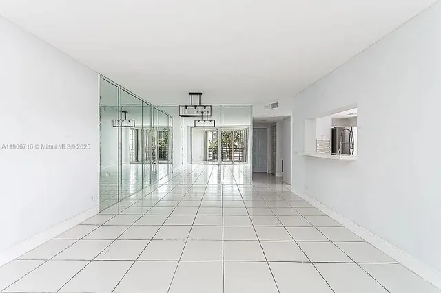 a view of an empty room and window