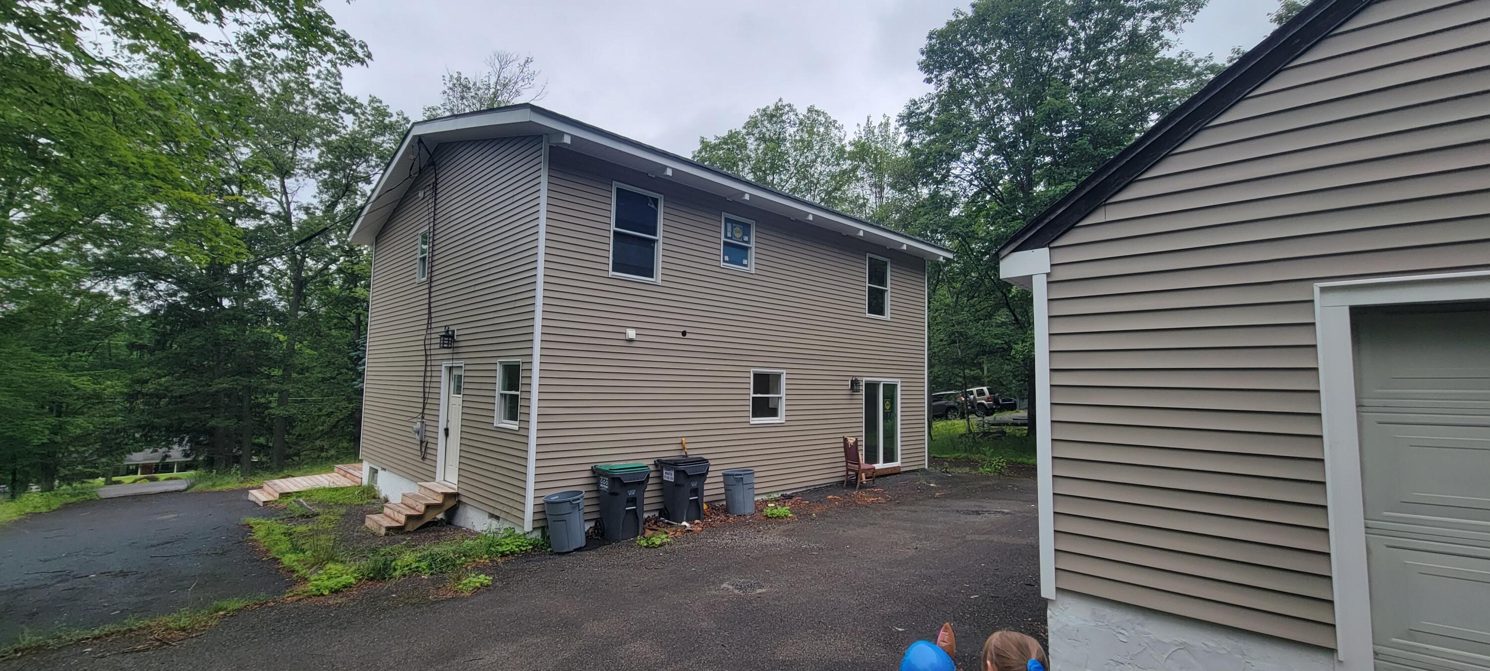 1183 Falls Road Bushkill, PA 18324 - Photo 44 of 47 Rear of Home w/Garage