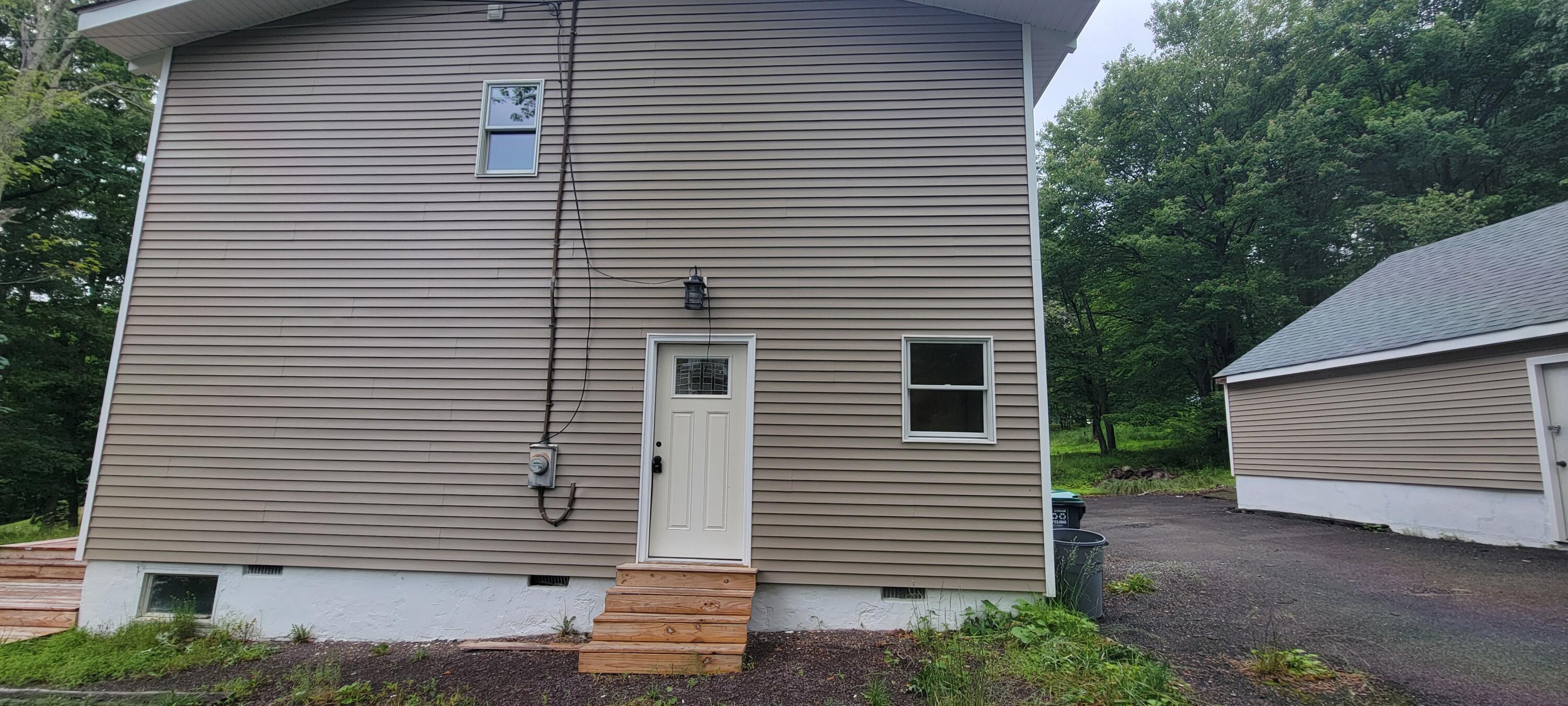 1183 Falls Road Bushkill, PA 18324 - Photo 46 of 47 Side View of Home w/Entrance