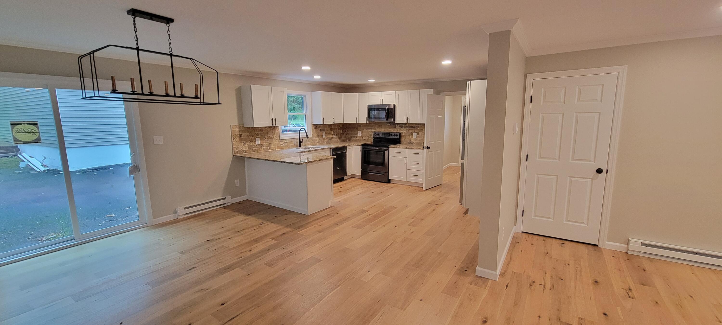 1183 Falls Road Bushkill, PA 18324 - Photo 9 of 47 Dining Area w/Chandelier