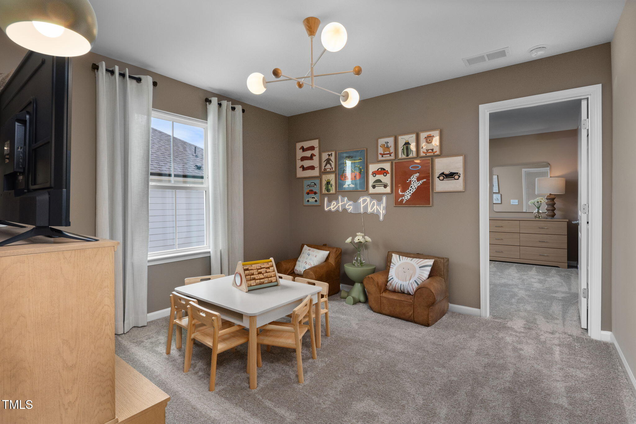 700 Ben Ledi Court Raleigh, NC 27603 - Photo 19 of 30 a living room with furniture and a large window