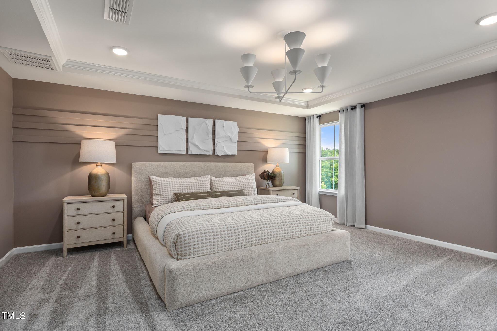 700 Ben Ledi Court Raleigh, NC 27603 - Photo 9 of 30 a spacious bedroom with a bed and a chandelier