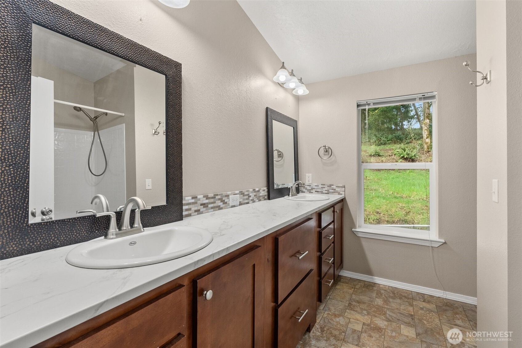126 Burchett Road Onalaska, WA 98570 - Photo 14 of 36 a bathroom with a double vanity sink and a mirror