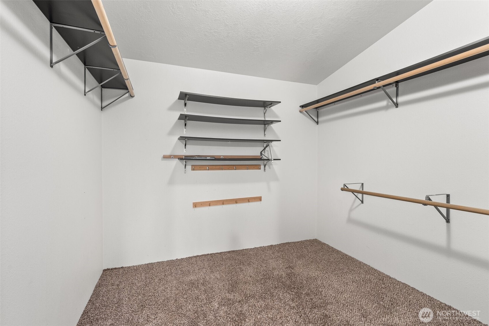 126 Burchett Road Onalaska, WA 98570 - Photo 18 of 36 a view of a room with racks on the wall