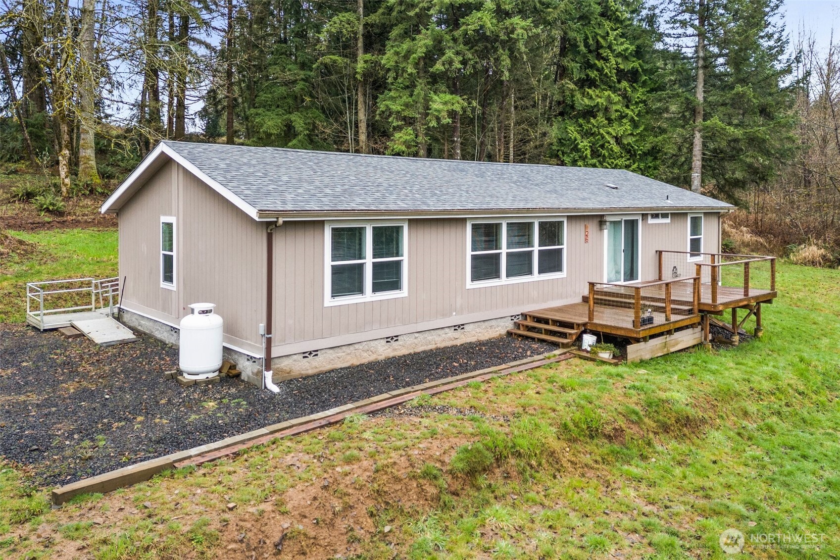 126 Burchett Road Onalaska, WA 98570 - Photo 2 of 36 a house view with a backyard space