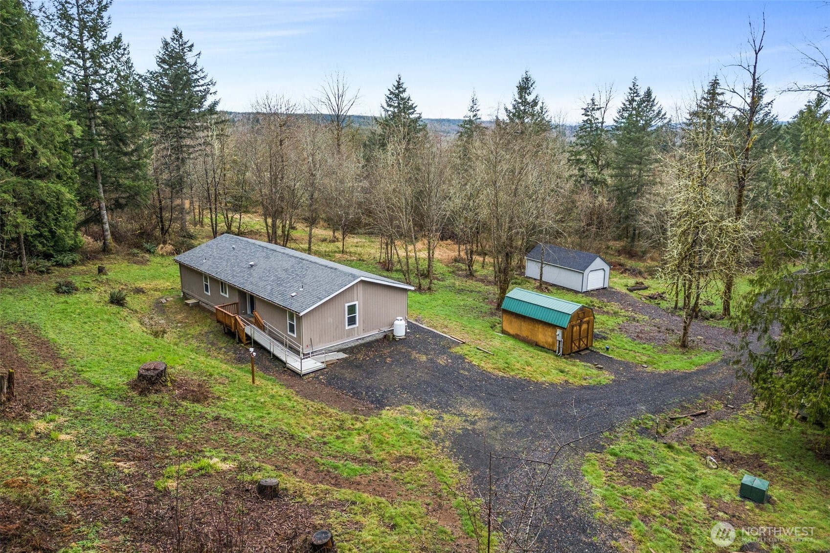 126 Burchett Road Onalaska, WA 98570 - Photo 23 of 36 a view of a small house with a yard