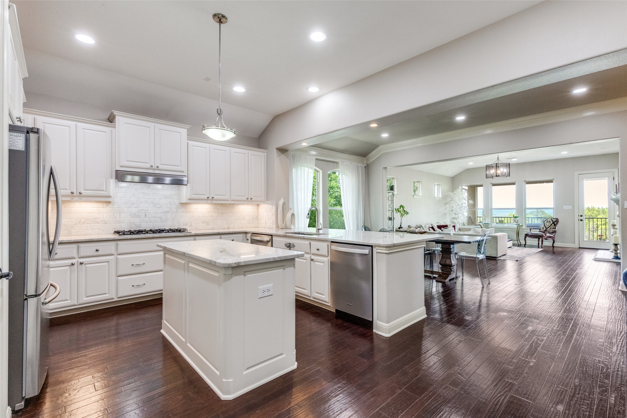 2312 Rivina Drive Austin, TX 78733 - Photo 20 of 40 Bright kitchen with gas cooktop, gorgeous natural stone countertops