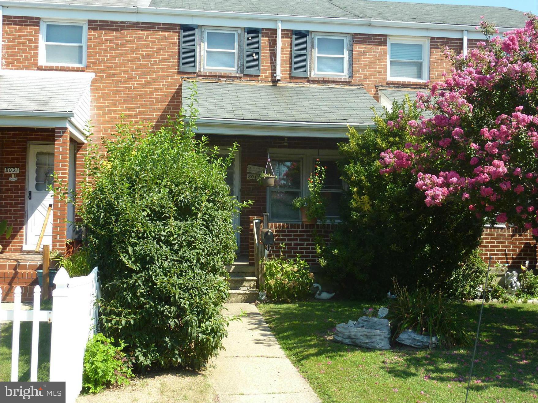 8019 Charlesmont Road Baltimore, MD 21222 - Photo 1 of 25 a front view of a house with garden