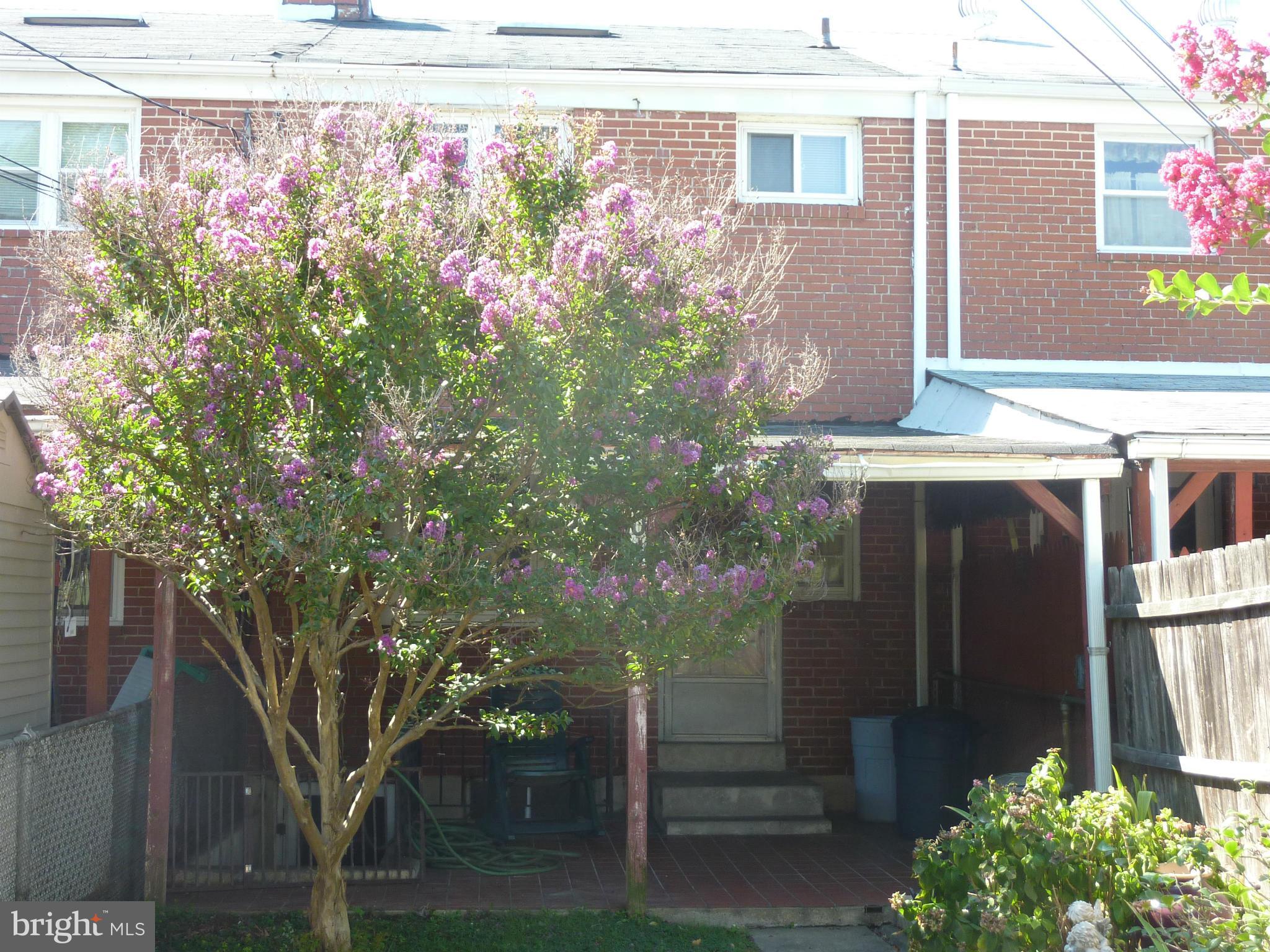 8019 Charlesmont Road Baltimore, MD 21222 - Photo 21 of 25 a front view of a house with plants