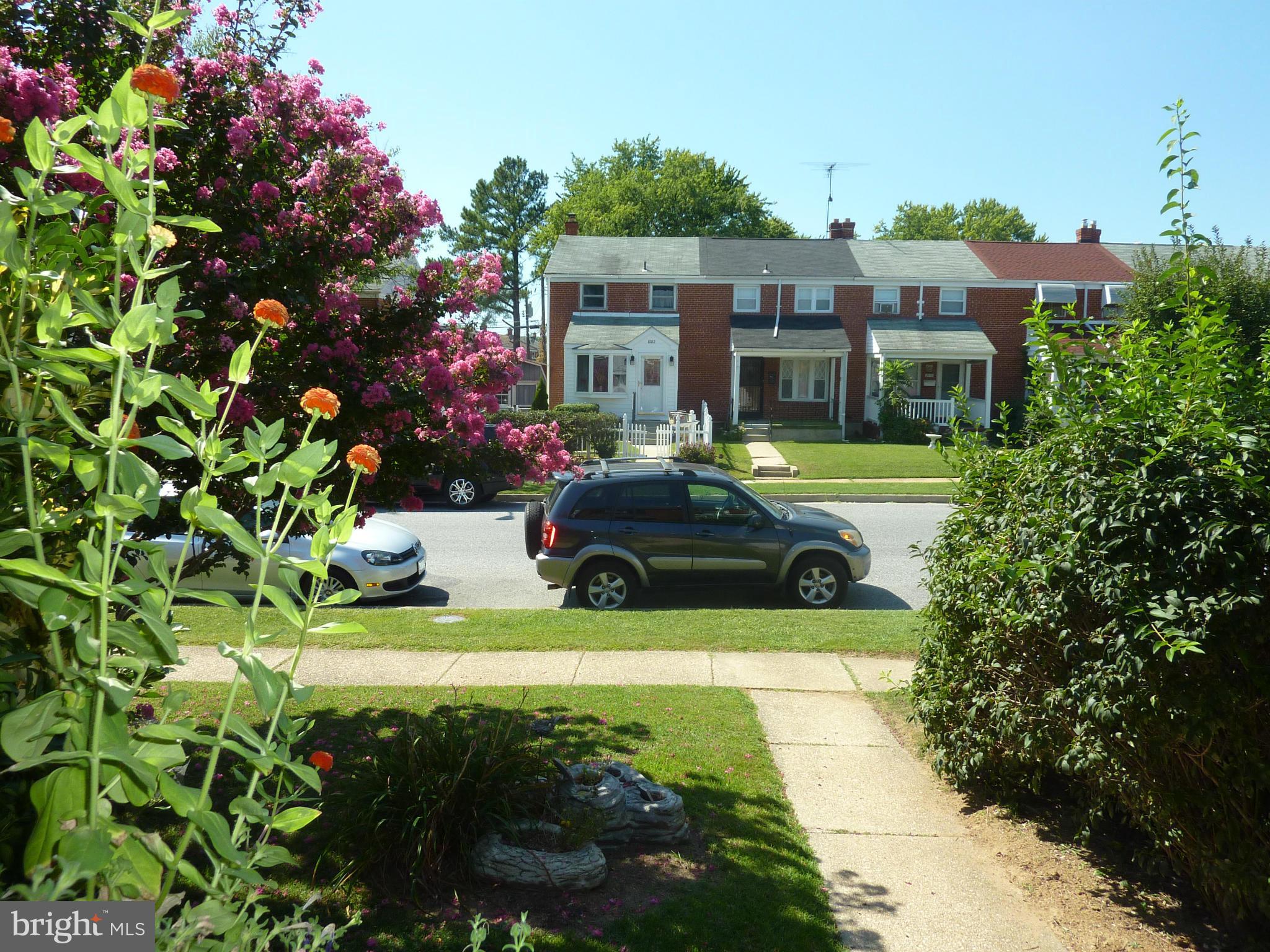8019 Charlesmont Road Baltimore, MD 21222 - Photo 5 of 25 a front view of a house with yard