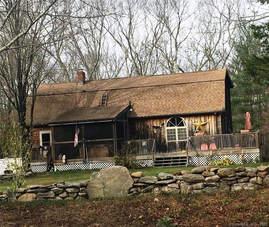 35 Wade Road Pomfret, CT 06259 - Photo 1 of 1 a front view of a house with garden