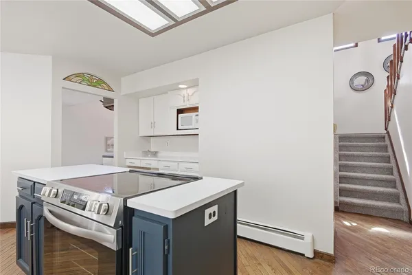 a kitchen that has a sink and cabinets