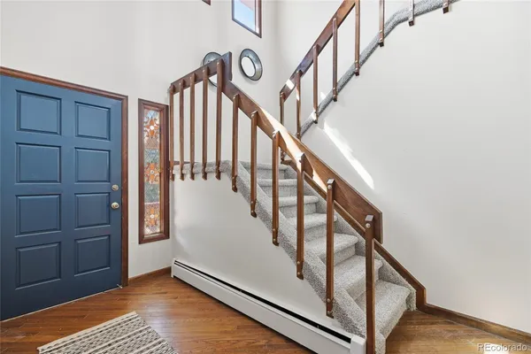 a view of entryway with wooden floor