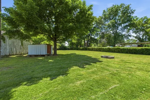a view of a back yard with green space