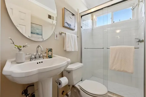 a spacious bedroom with a bed and a couch