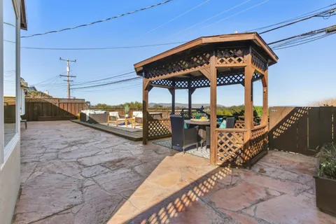 an aerial view of mountain with trees around