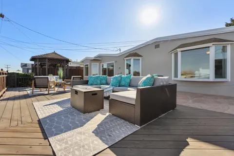 a view of a balcony with wooden floor