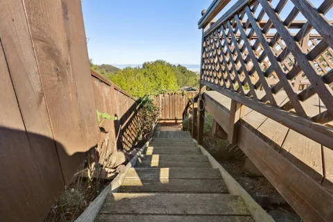 a view of balcony with furniture
