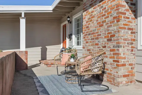 a view of a balcony with chairs