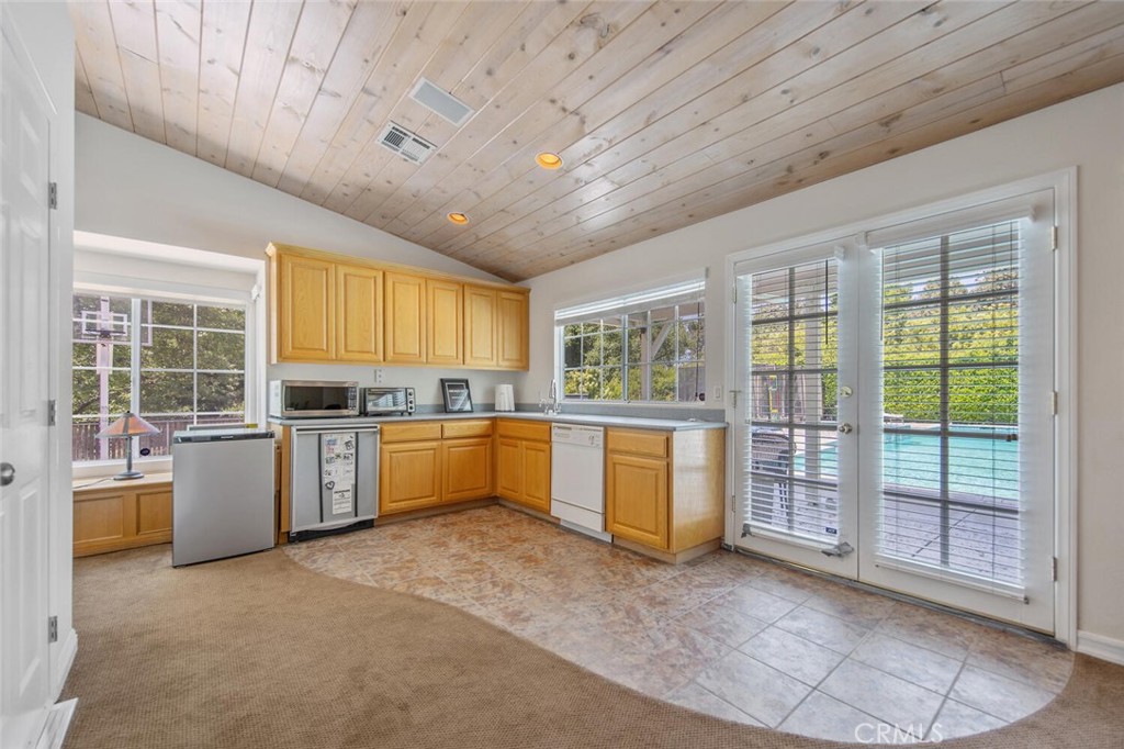 15744 Beaver Run Road Canyon Country, CA 91387 - Photo 40 of 55 a large kitchen with a stove and a large window