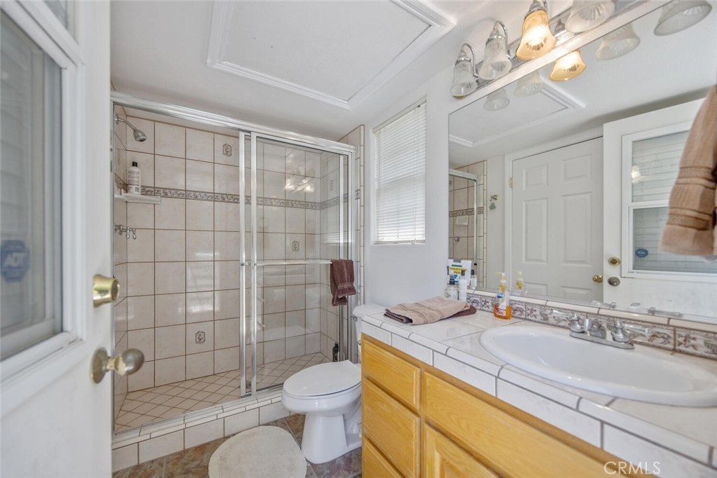 15744 Beaver Run Road Canyon Country, CA 91387 - Photo 42 of 55 a bathroom with a sink a toilet and shower