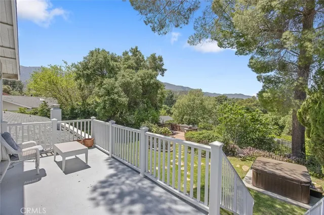 a view of a table and chairs in the garden