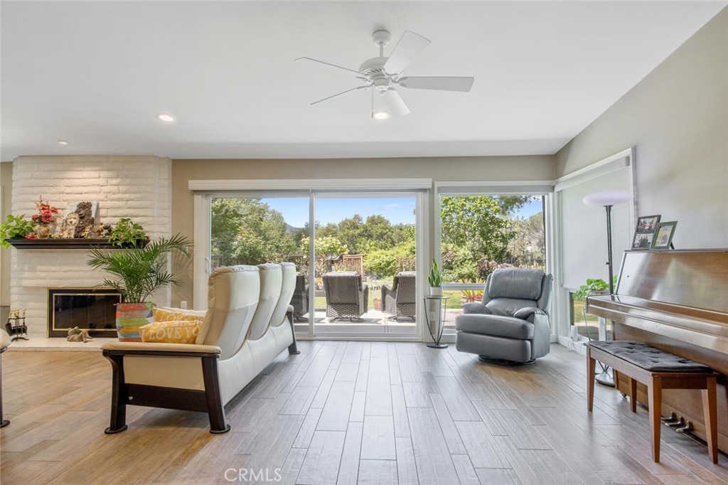15744 Beaver Run Road Canyon Country, CA 91387 - Photo 10 of 55 a living room with furniture and a fireplace